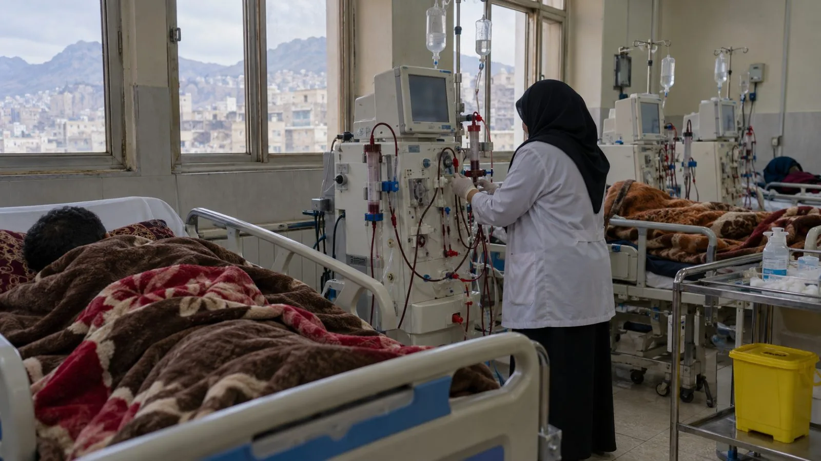 Dialysis machines stand beside treatment beds in a hospital ward in Taiz, Yemen (AI-generated image / EconoTimes)