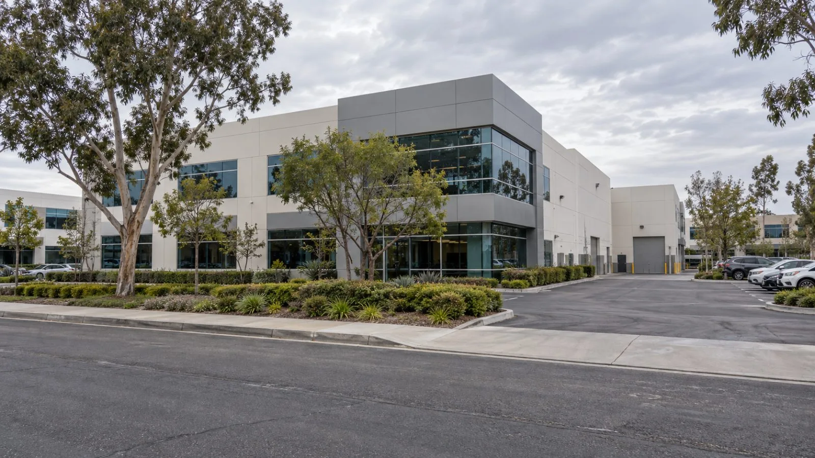 An office and laboratory building stands along a business park street in Irvine, California. (AI-generated image / EconoTimes)