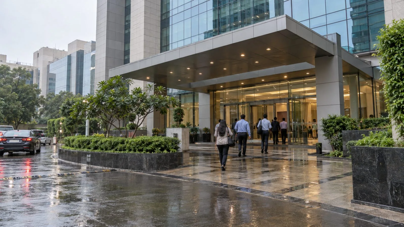 Employees enter an office building in Jasola, New Delhi, India, on an overcast morning. (AI-generated image / EconoTimes)