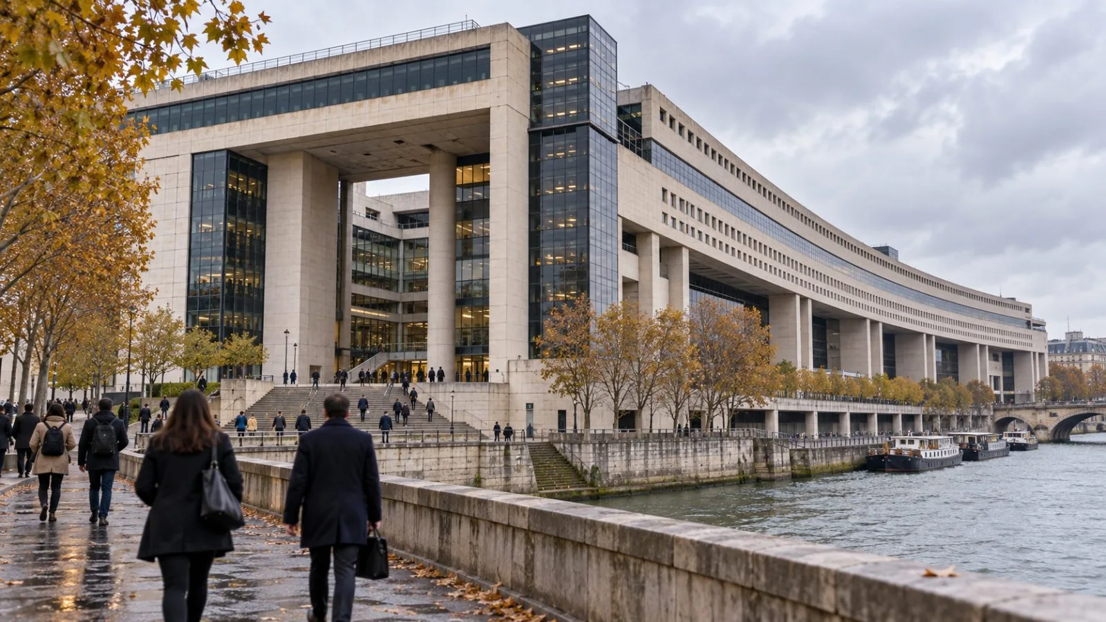 Commuters pass the French Ministry of Economy and Finance in Paris on an overcast autumn morning. / EconoTimes.ai