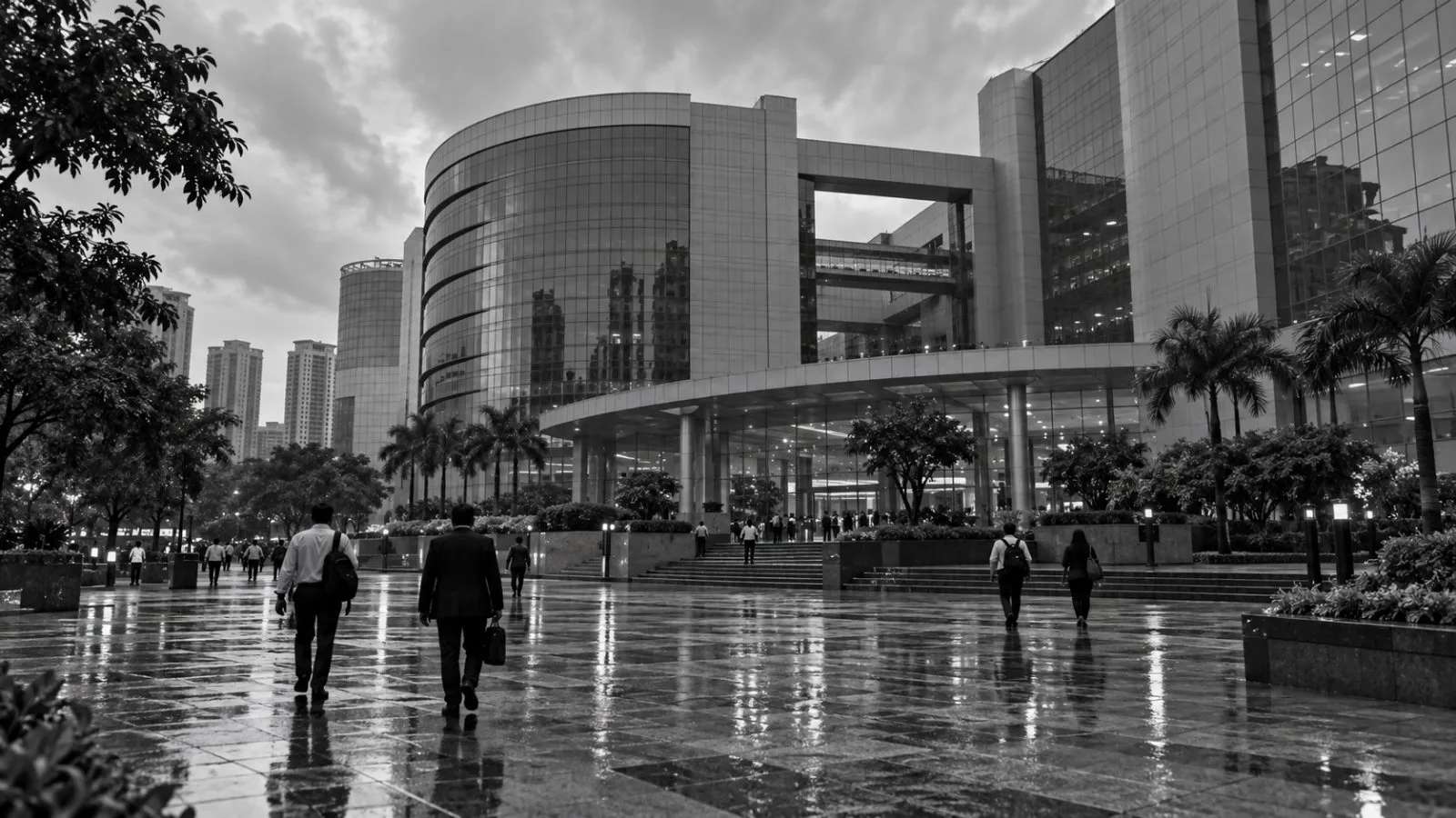 Commuters pass the National Stock Exchange building in Mumbai during the afternoon. / EconoTimes.ai