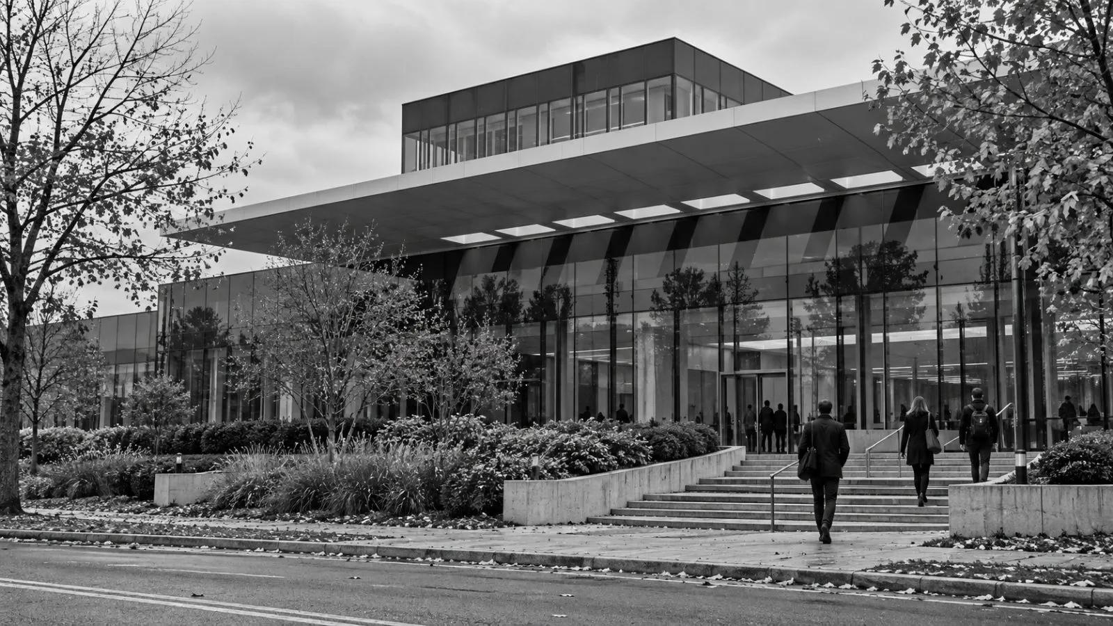Employees enter Philip Morris International's headquarters in Stamford, Connecticut, on an overcast morning. / EconoTimes.ai