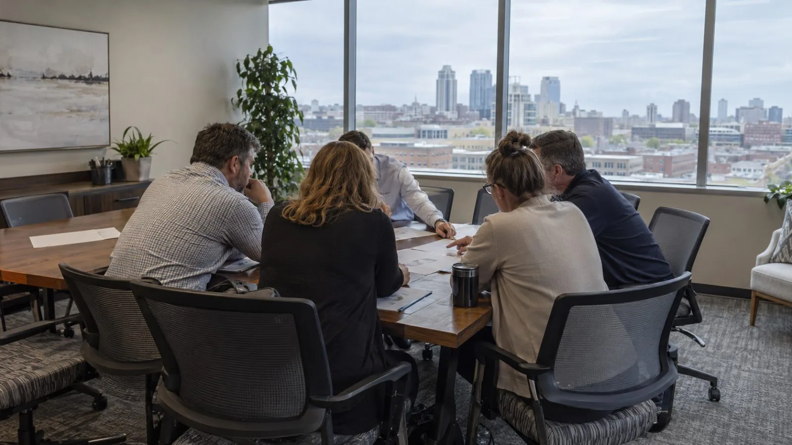 Credit union representatives review pilot proposals during a workshop in Kansas City. (AI-generated image / EconoTimes)