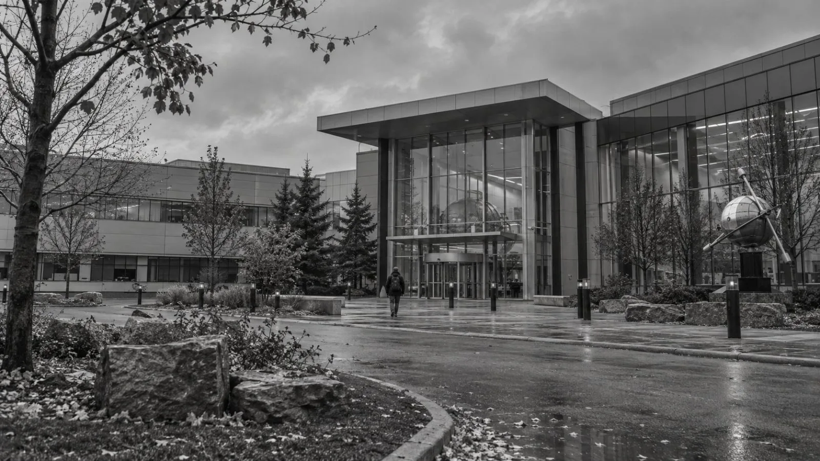 An employee approaches MDA Space’s headquarters in Brampton, Ontario, on an overcast morning (AI-generated image / EconoTimes)