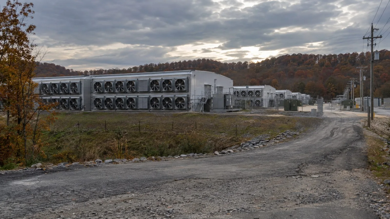 Ventilation equipment lines the exterior of a bitcoin mining facility in Duff, Tennessee. (AI-generated image / EconoTimes)