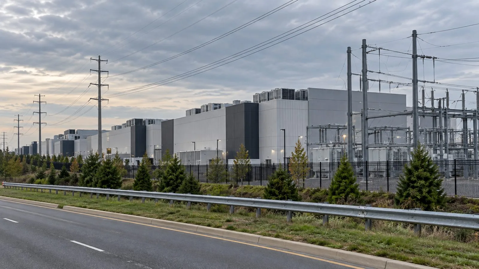 Data center buildings and power lines stand beneath an overcast sky in Ashburn, Virginia. (AI-generated image / EconoTimes)