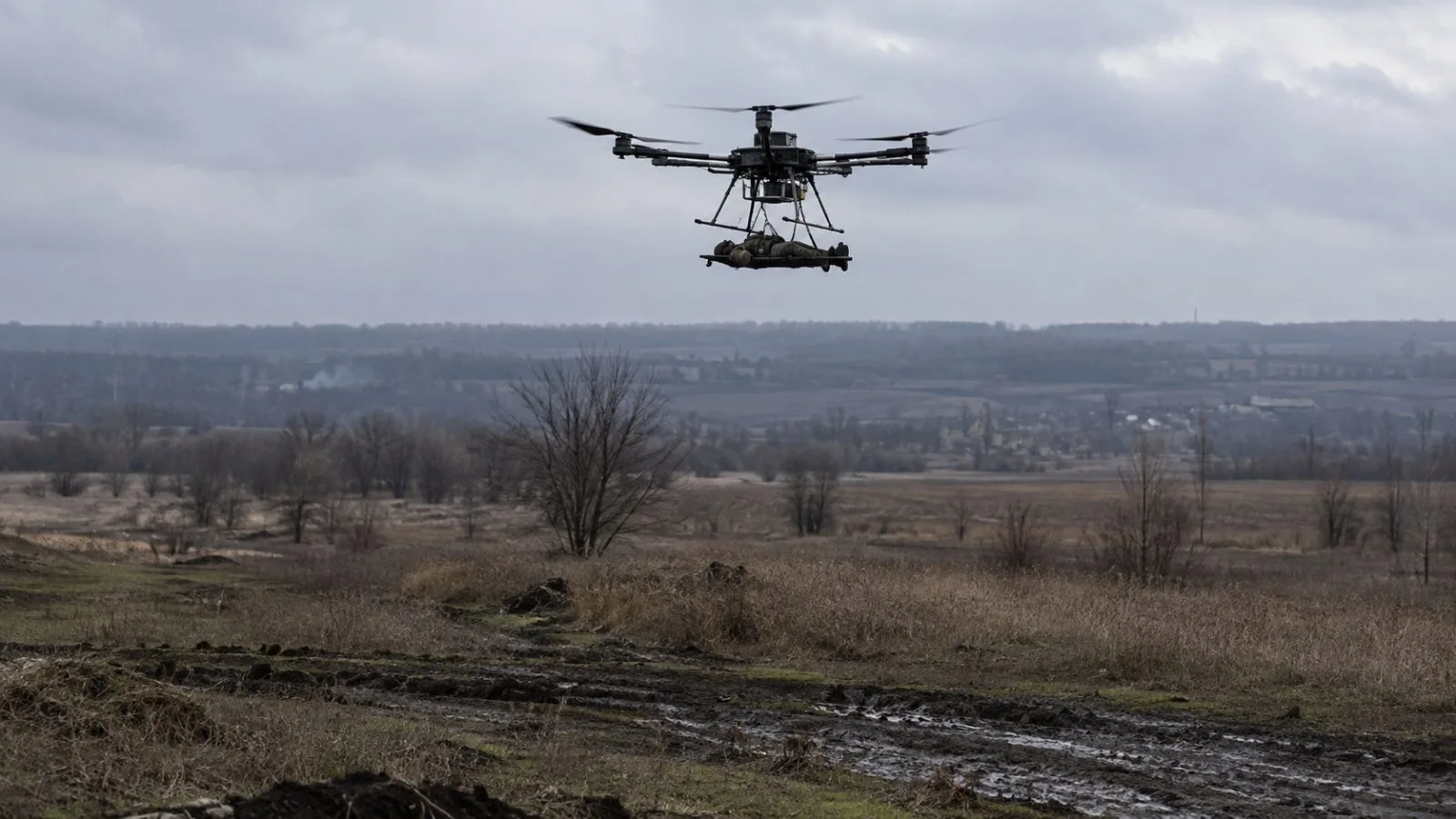 A heavy hexacopter carries a soldier above a field near Kupiansk, Ukraine. (AI-generated image / EconoTimes)