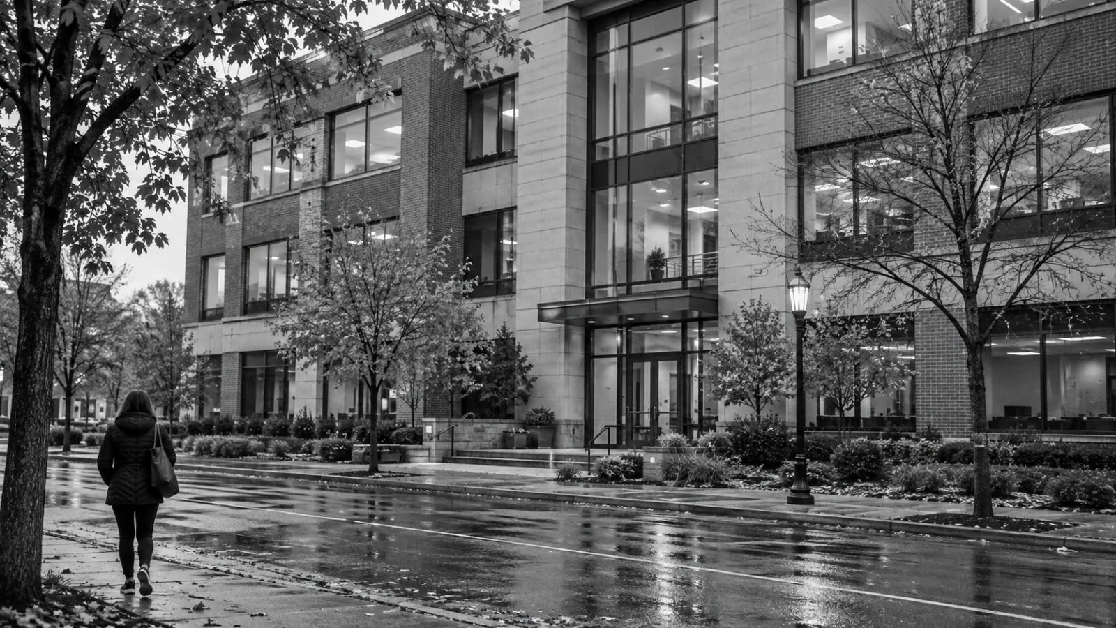 A pedestrian walks past office buildings on a commercial street in Wheaton, Illinois. (AI-generated image / EconoTimes)