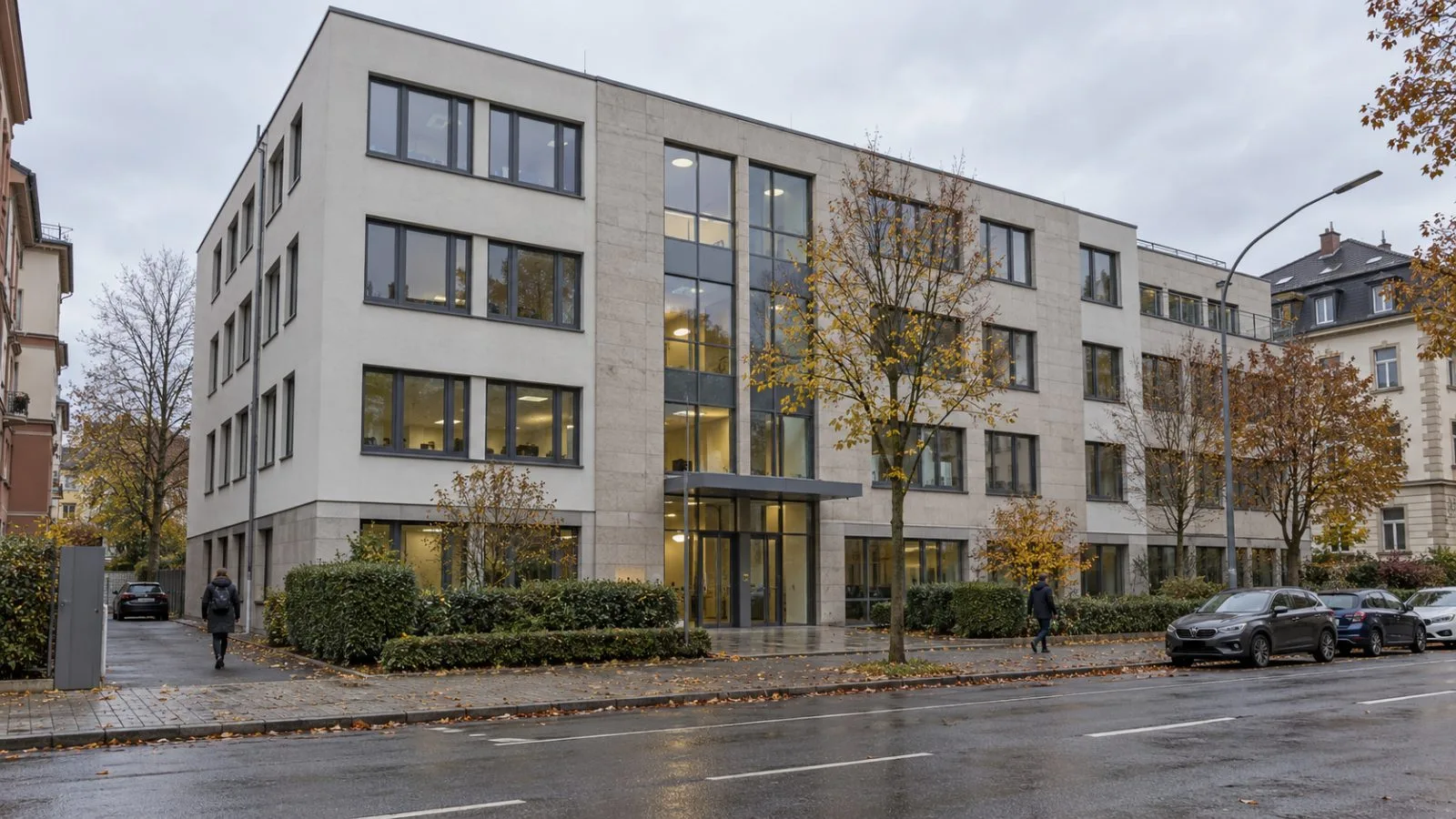 The Wolters Kluwer Steuertipps office stands on Havellandstraße in Mannheim, Germany, under a gray autumn sky. (AI-generated image / EconoTimes)