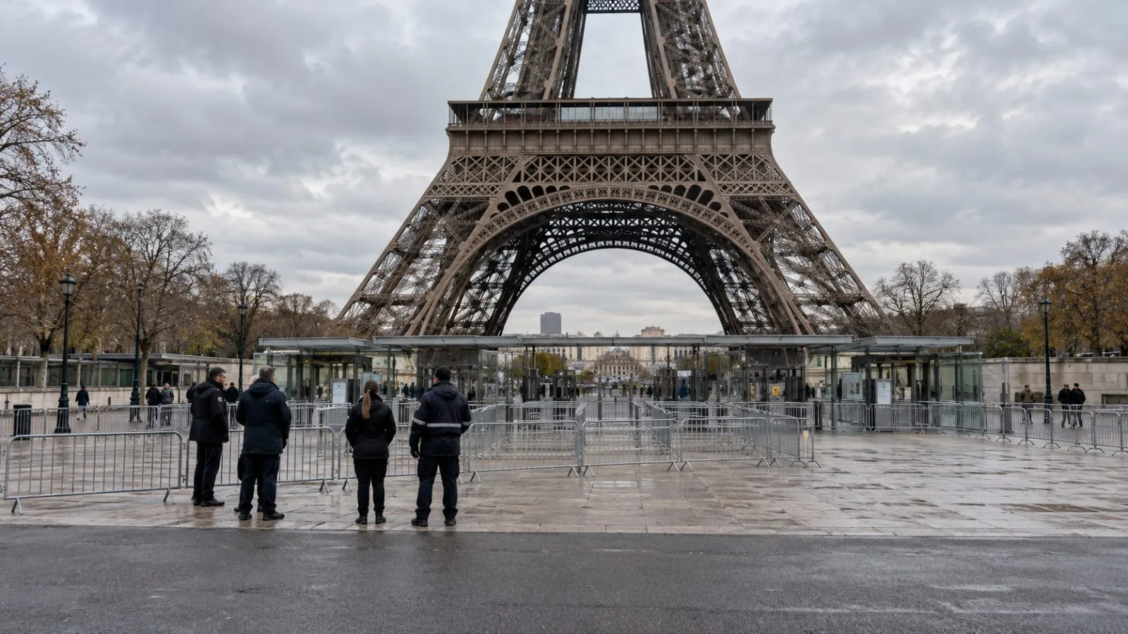 Workers gather outside the Eiffel Tower in Paris during a one-day closure. (AI-generated image / EconoTimes)