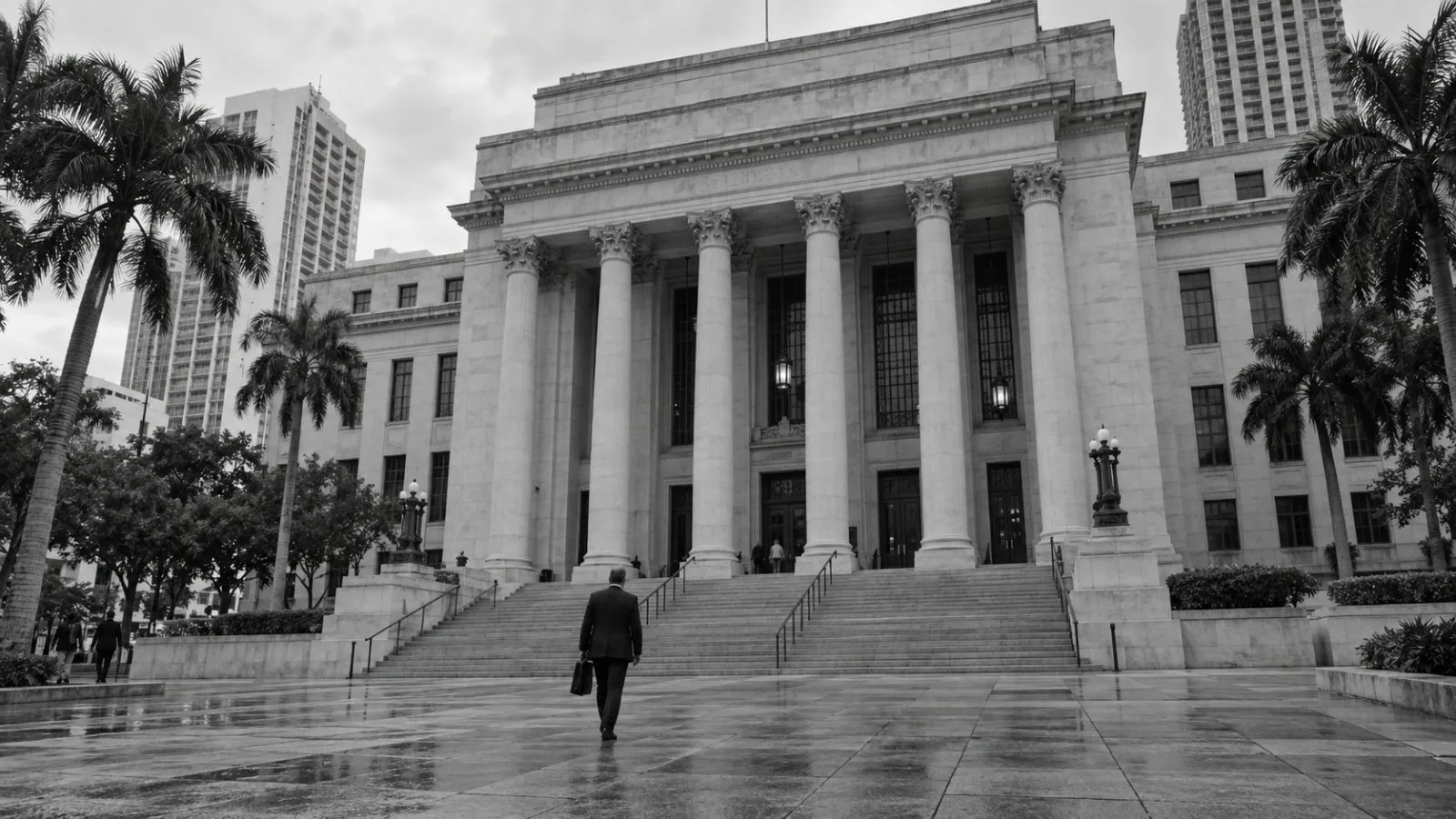 A visitor approaches a state courthouse in Miami, Florida, under overcast skies. (AI-generated image / EconoTimes)