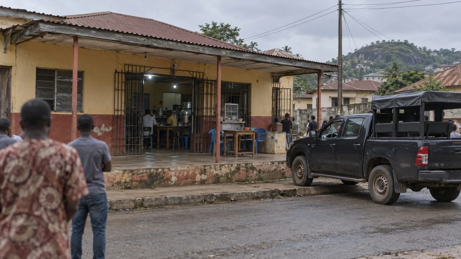 A police vehicle is parked outside a restaurant in Ado-Ekiti, Nigeria. (AI-generated image / EconoTimes)