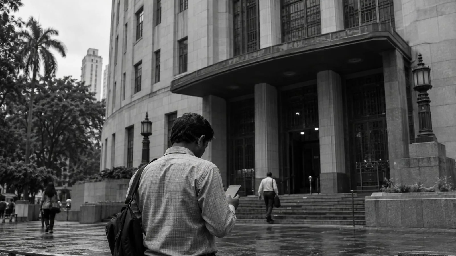 A visitor checks a phone outside the Reserve Bank of India headquarters in Mumbai. (AI-generated image / EconoTimes)