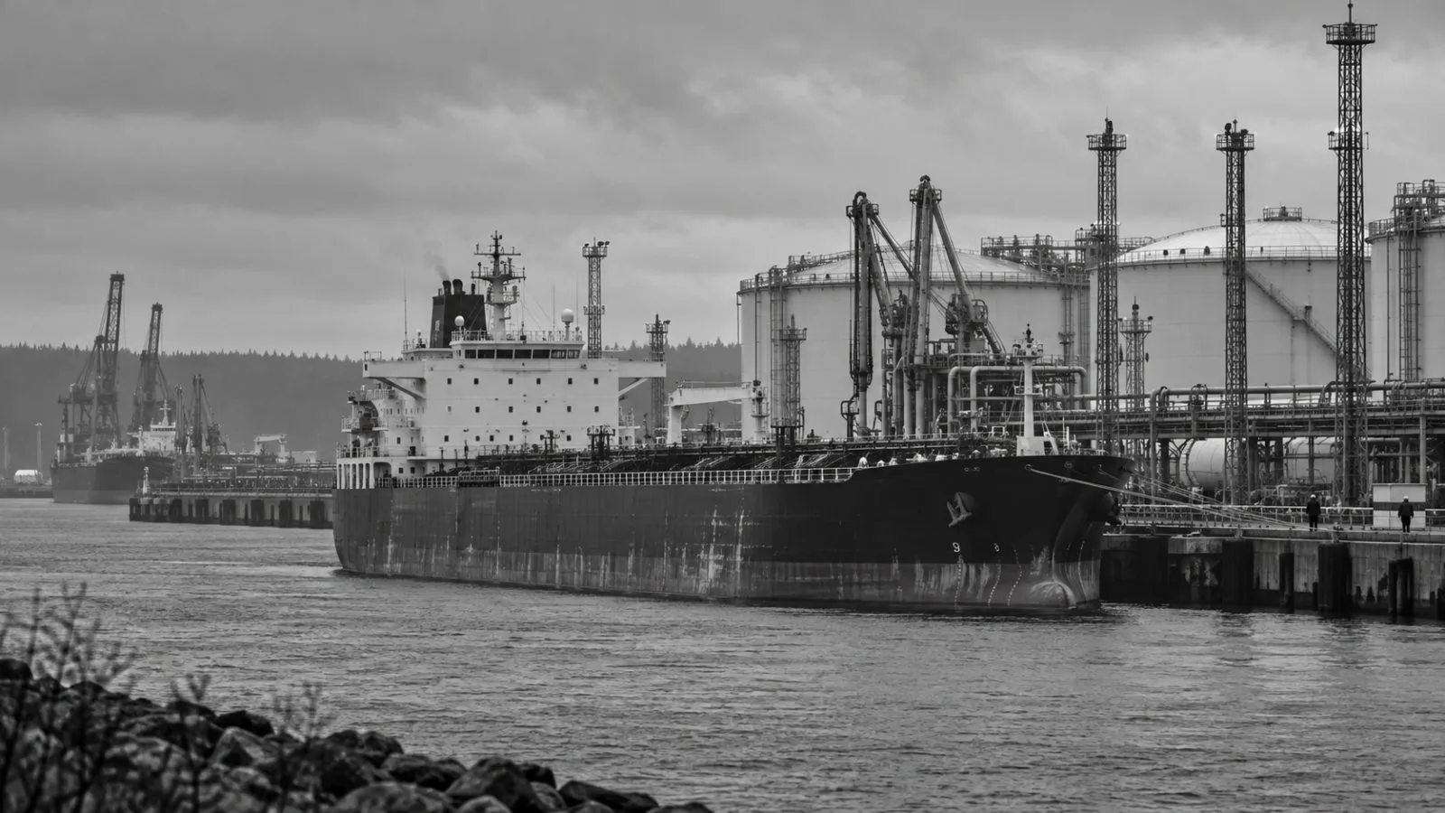 A tanker sits beside fuel storage tanks at the Port of Primorsk, Russia. (AI-generated image / EconoTimes)