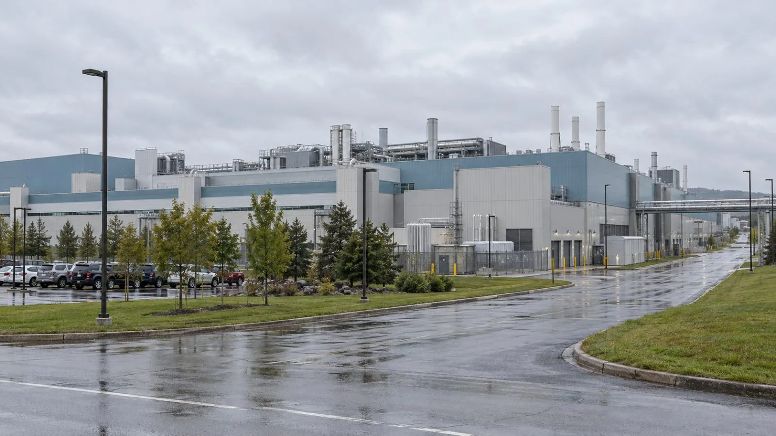 A semiconductor fabrication building stands at GlobalFoundries’ campus in Malta, New York. / EconoTimes.ai