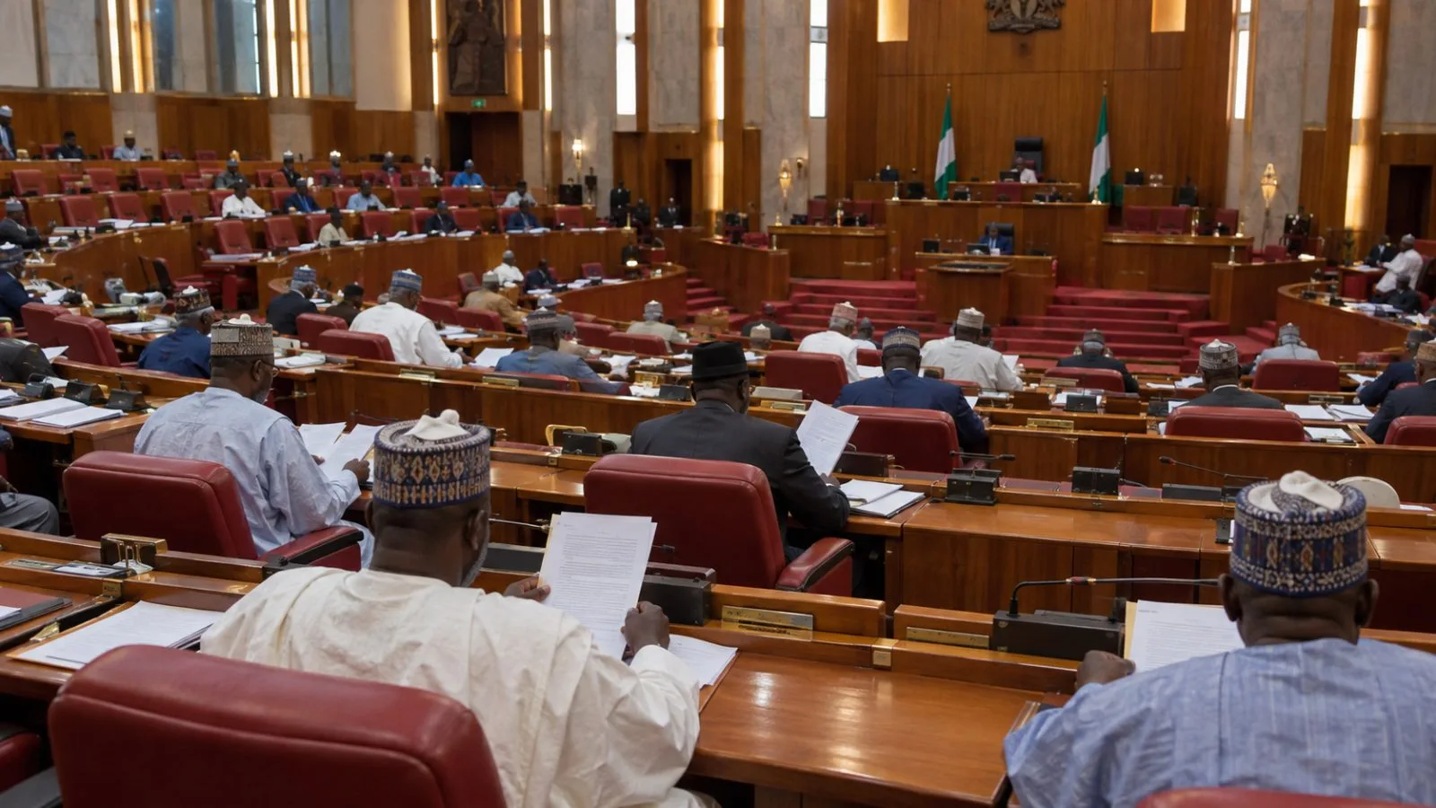 Members sit in Nigeria’s Senate chamber during a plenary session at the National Assembly in Abuja. (AI-generated image / EconoTimes)