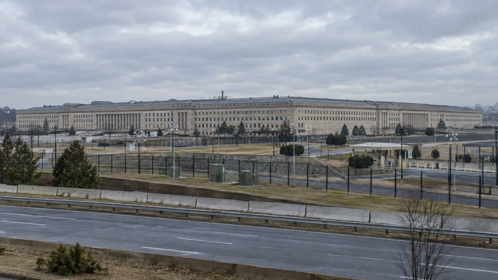People enter NATO headquarters in Brussels beneath a gray autumn sky. / EconoTimes.ai