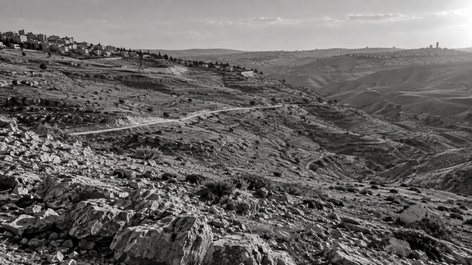 A road crosses the E1 tract near Ma'ale Adumim in the occupied West Bank. (AI-generated image / EconoTimes)