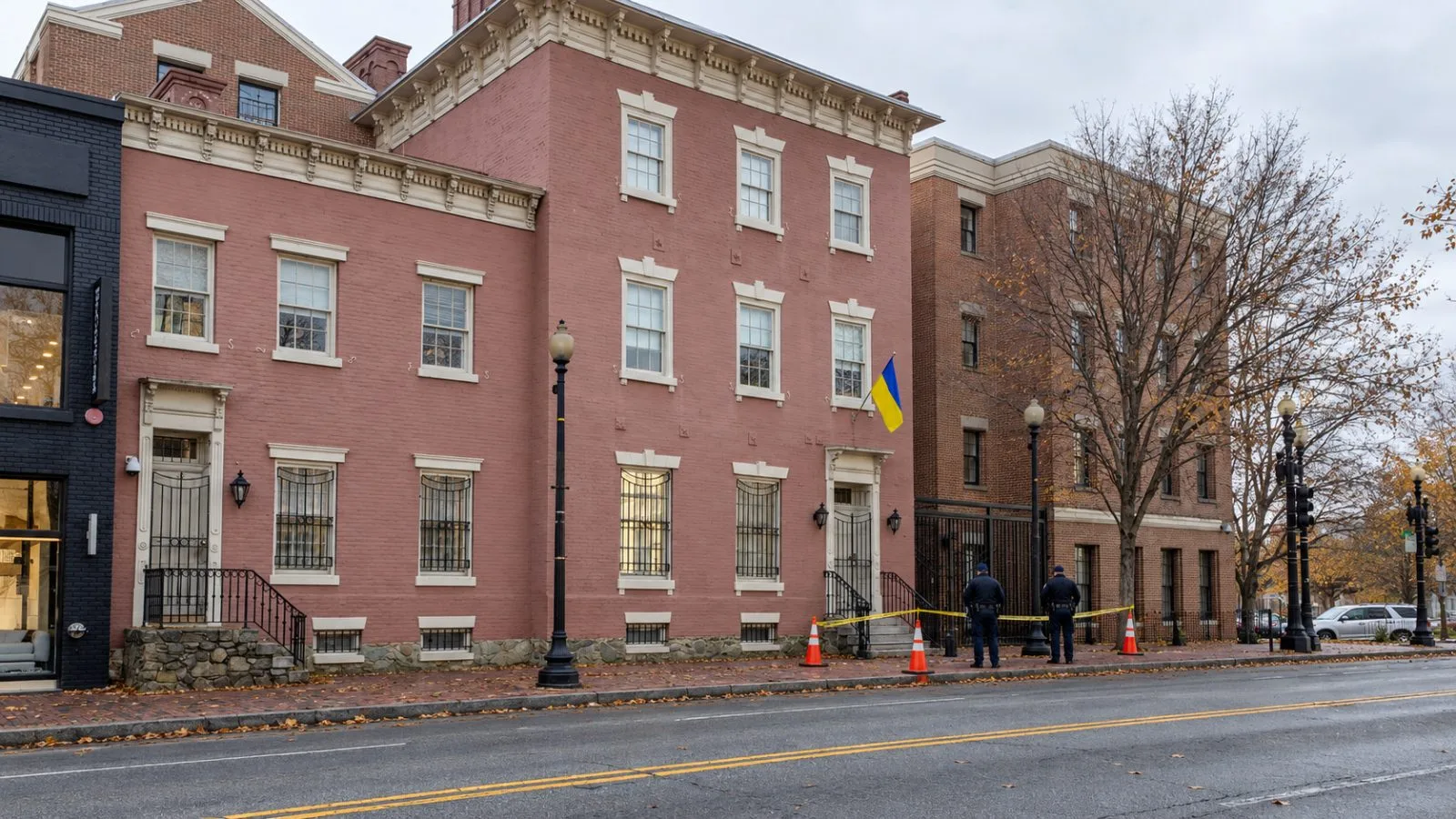 Officers inspect the cordoned sidewalk beside the Ukrainian Embassy’s consular entrance in Washington, D.C. / EconoTimes.ai