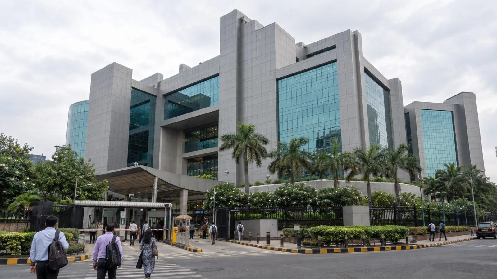 Commuters pass the National Stock Exchange complex in Mumbai’s Bandra-Kurla business district. (AI-generated image / EconoTimes)