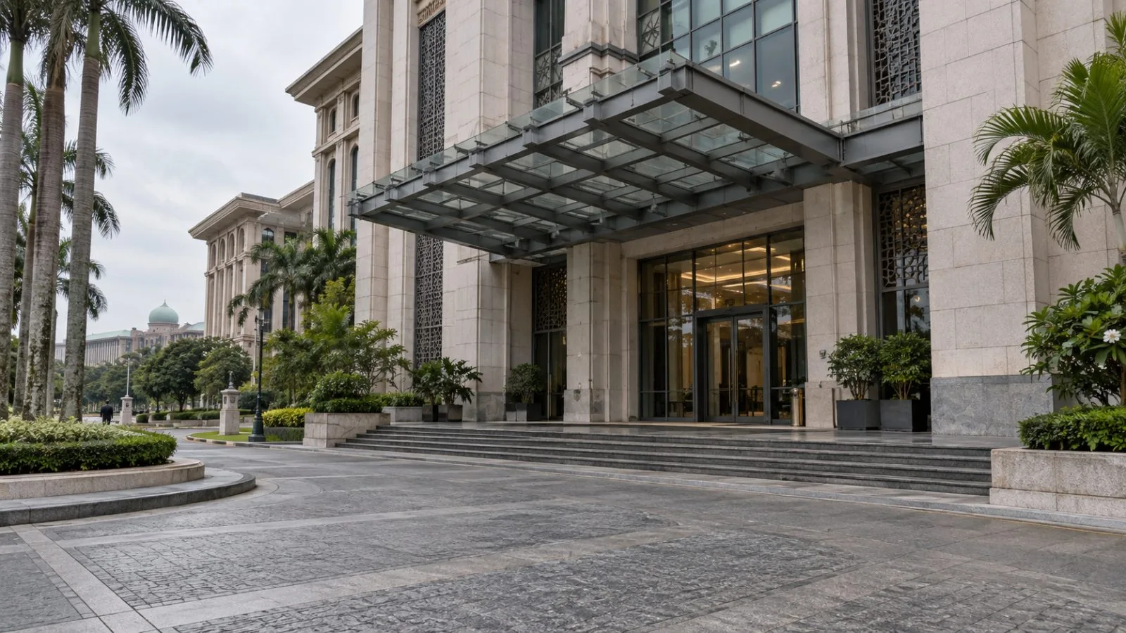 A quiet office entrance stands under overcast skies in Putrajaya, Malaysia. (AI-generated image / EconoTimes)