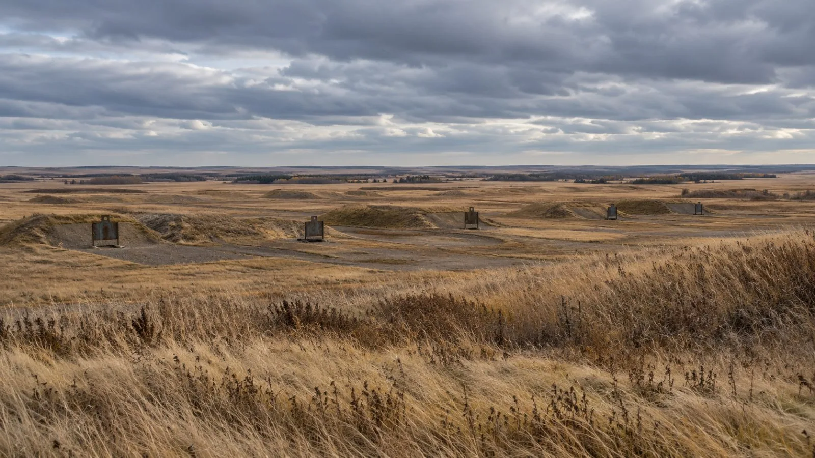 Dry grass borders a live-fire training range at Canadian Forces Base Wainwright, Alberta. (AI-generated image / EconoTimes)