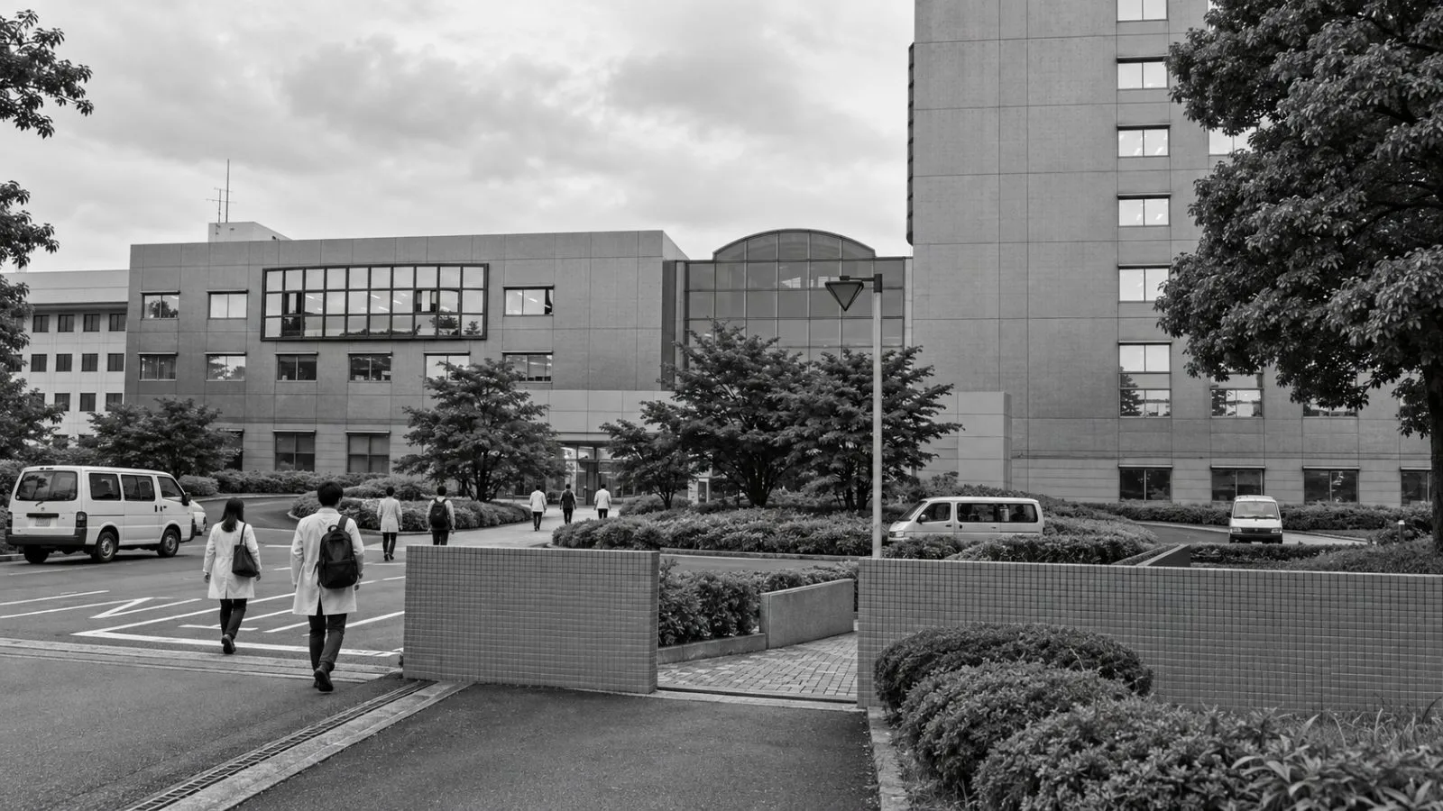 Researchers walk past a laboratory building in Tsukuba, Japan. / EconoTimes.ai