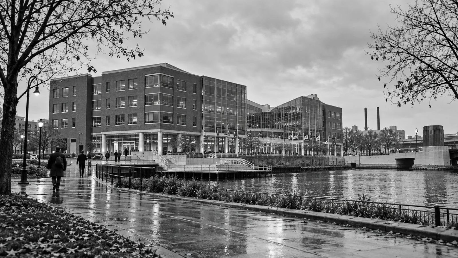 Employees enter the headquarters building in Milwaukee, Wisconsin, under gray morning skies. / EconoTimes.ai