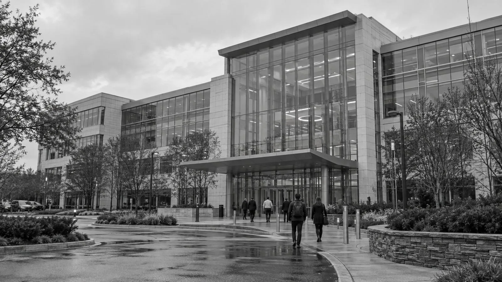 Workers enter an office building on Bashan Drive in Ashburn, Virginia. / EconoTimes.ai (mono)