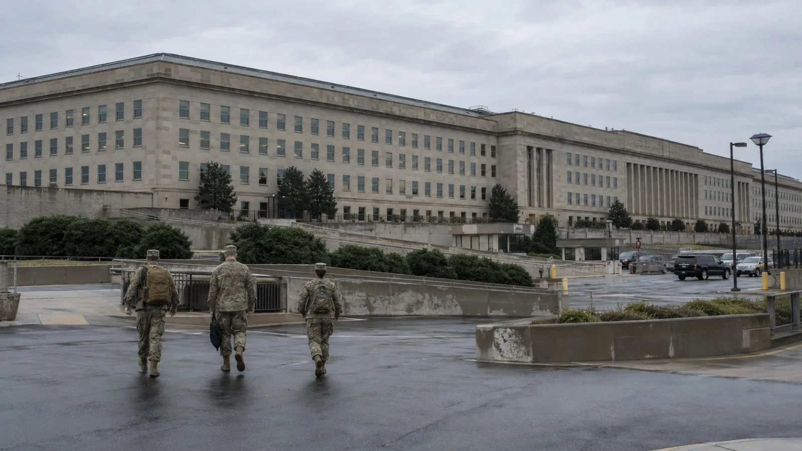 The Pentagon’s facade rises above its grounds in Arlington, Virginia, as personnel cross the plaza. (AI-generated image / EconoTimes)
