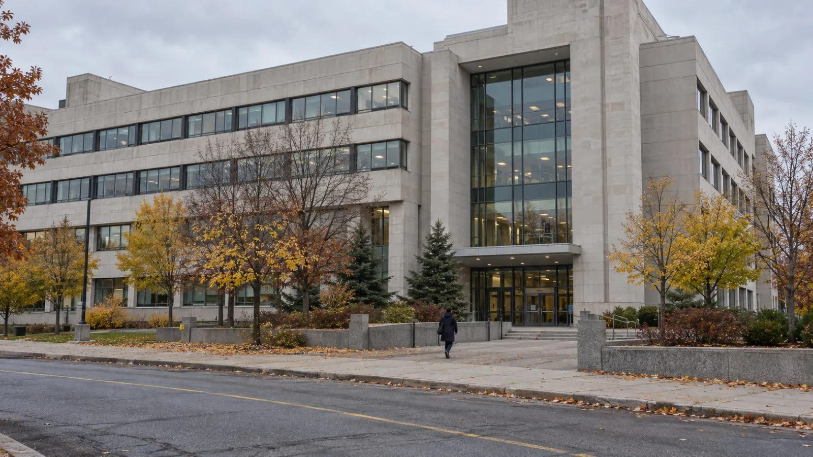 A staff member approaches Statistics Canada’s headquarters in Ottawa on an overcast autumn morning. (AI-generated image / EconoTimes)