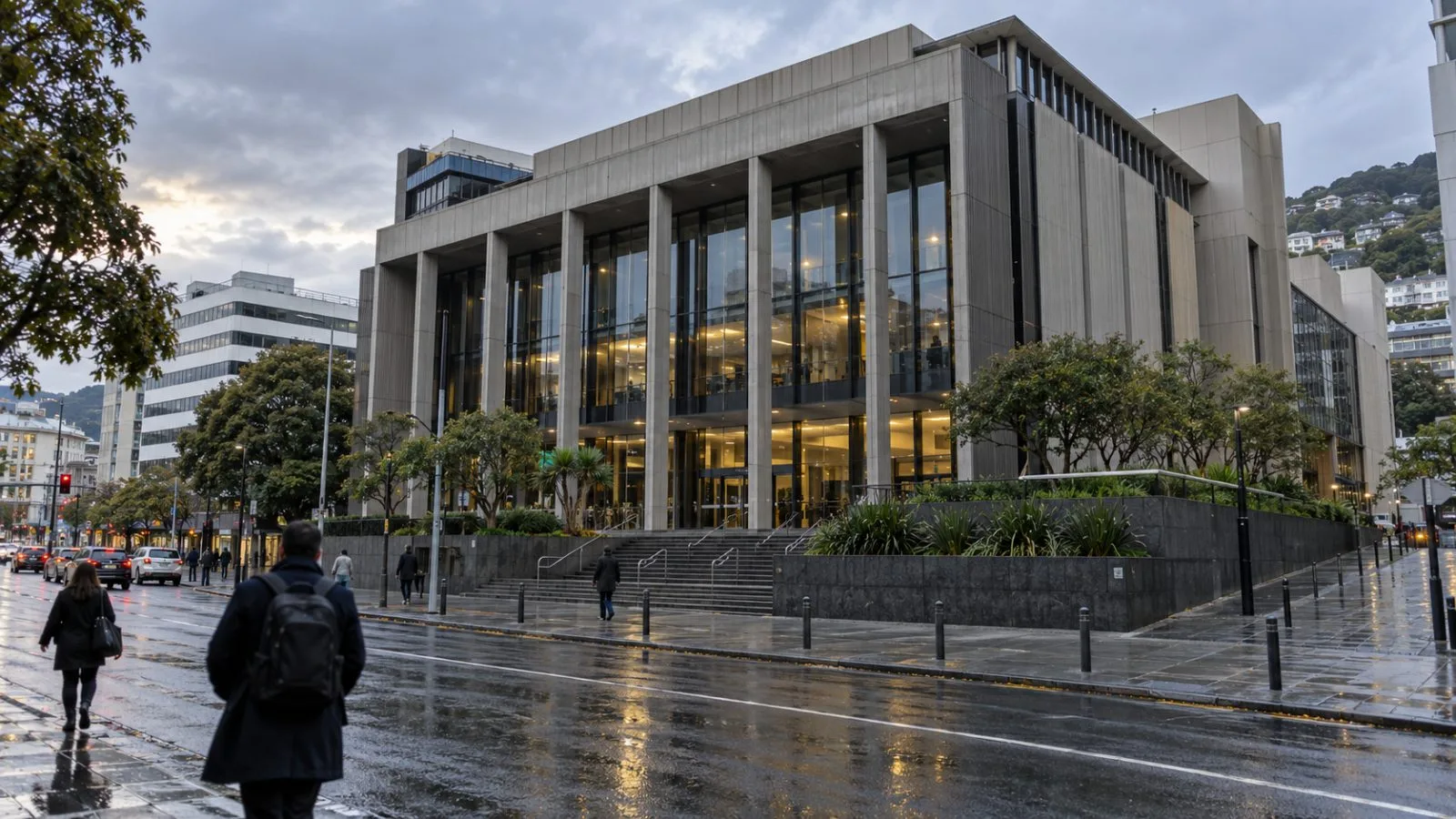 Pedestrians pass the Reserve Bank of New Zealand in Wellington on an overcast morning / EconoTimes.ai