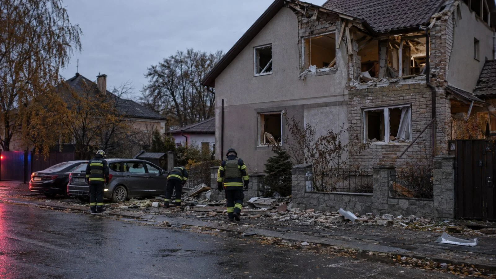 Rescue workers inspect a damaged private home after a drone strike in Zhytomyr, Ukraine. (AI-generated image / EconoTimes)