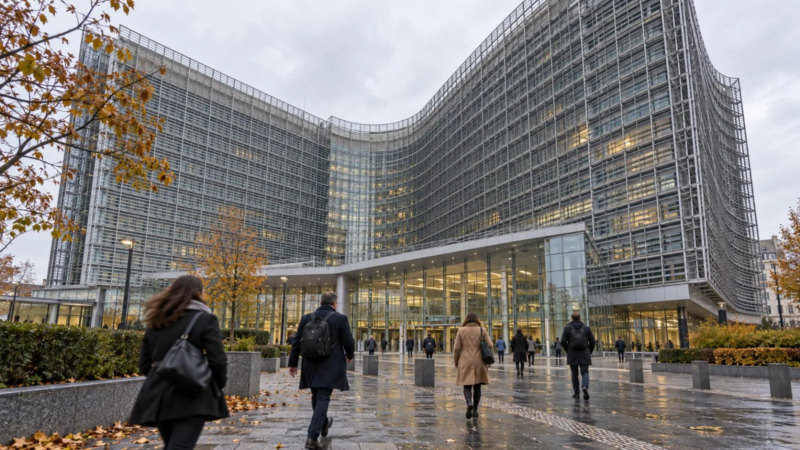 Pedestrians pass the Berlaymont building in Brussels, Belgium. / EconoTimes.ai