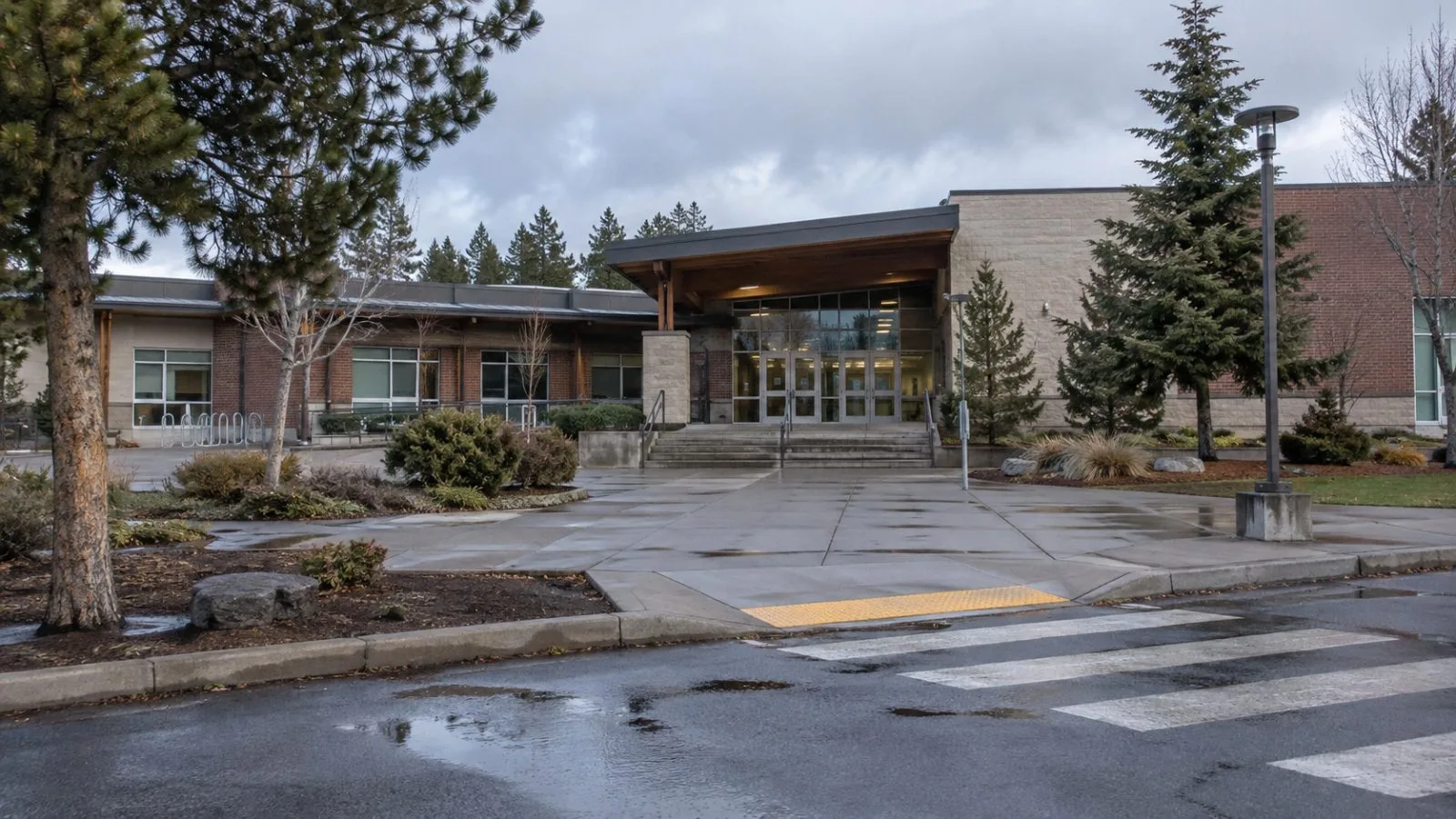 The entrance to Silver Rail Elementary School stands quiet in Bend, Oregon. (AI-generated image / EconoTimes)