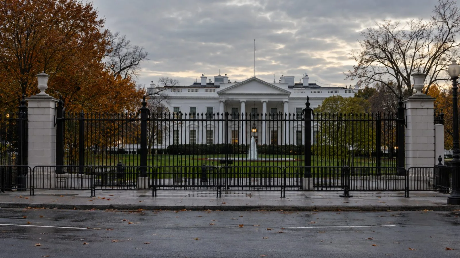 Security fencing frames the White House in Washington, D.C., beneath an overcast autumn sky. (AI-generated image / EconoTimes)