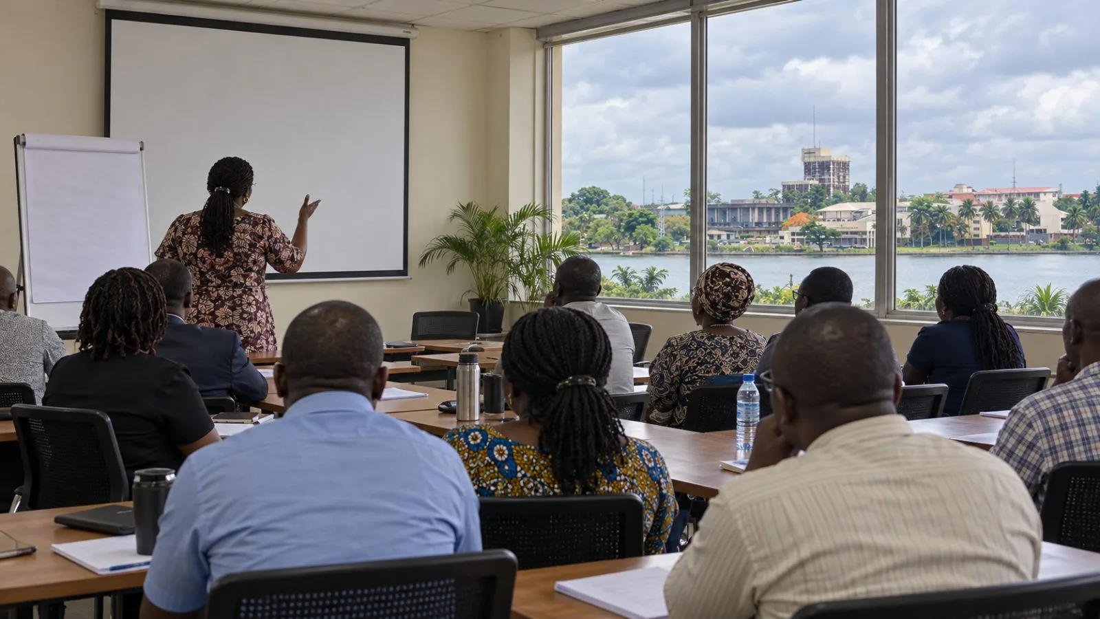Staff attend a workshop in a meeting room at the University of Lagos, Nigeria. / EconoTimes.ai