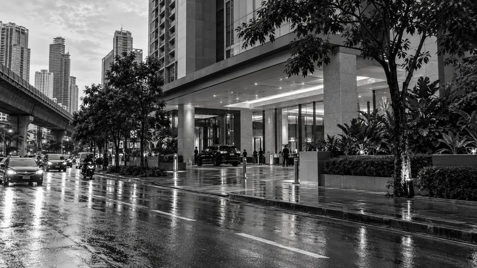 A hotel entrance stands along Sathorn Road in Bangkok, Thailand. (AI-generated image / EconoTimes)