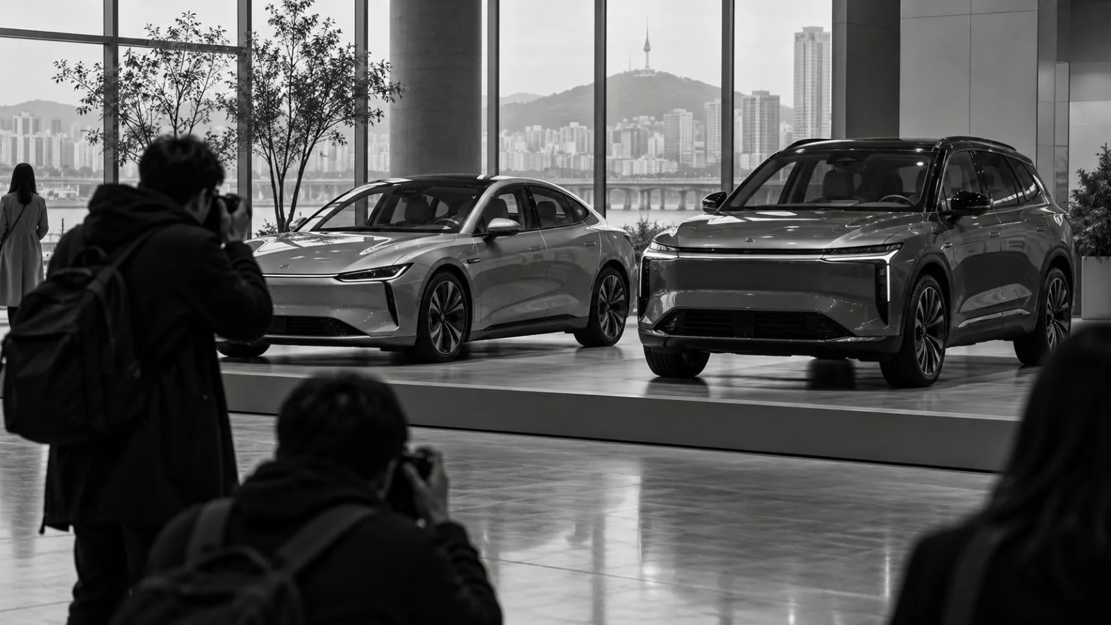 An electric sedan and SUV stand on display at a vehicle launch venue in Seoul, South Korea (AI-generated image / EconoTimes)