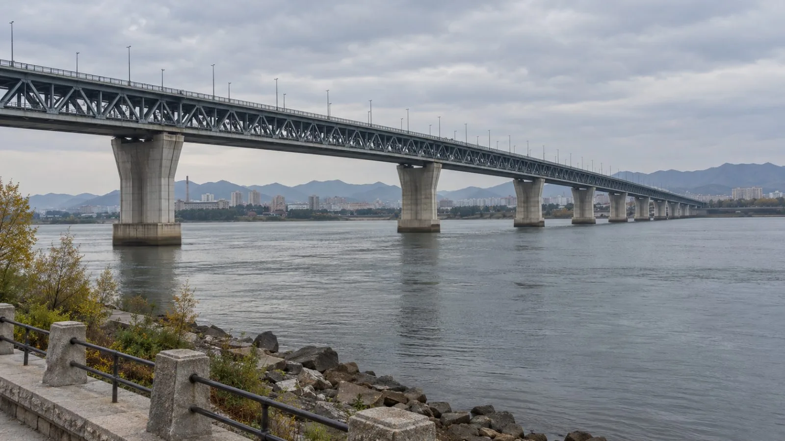 The New Yalu River Bridge spans the Yalu River in Dandong, China. (AI-generated image / EconoTimes)