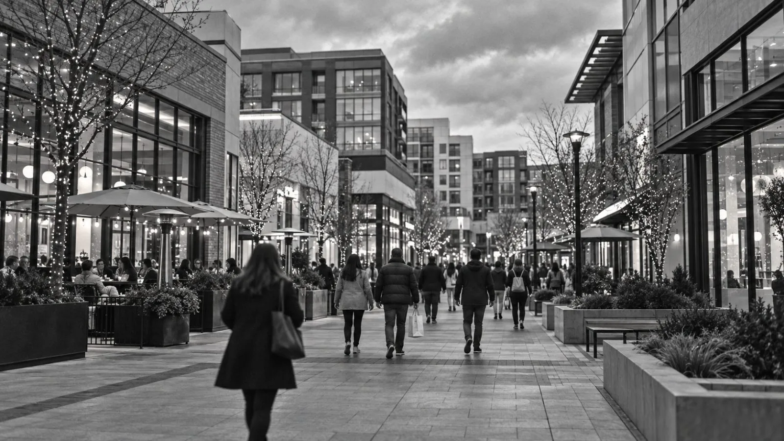Shoppers walk past storefronts at Pike & Rose in North Bethesda, Maryland. / EconoTimes.ai