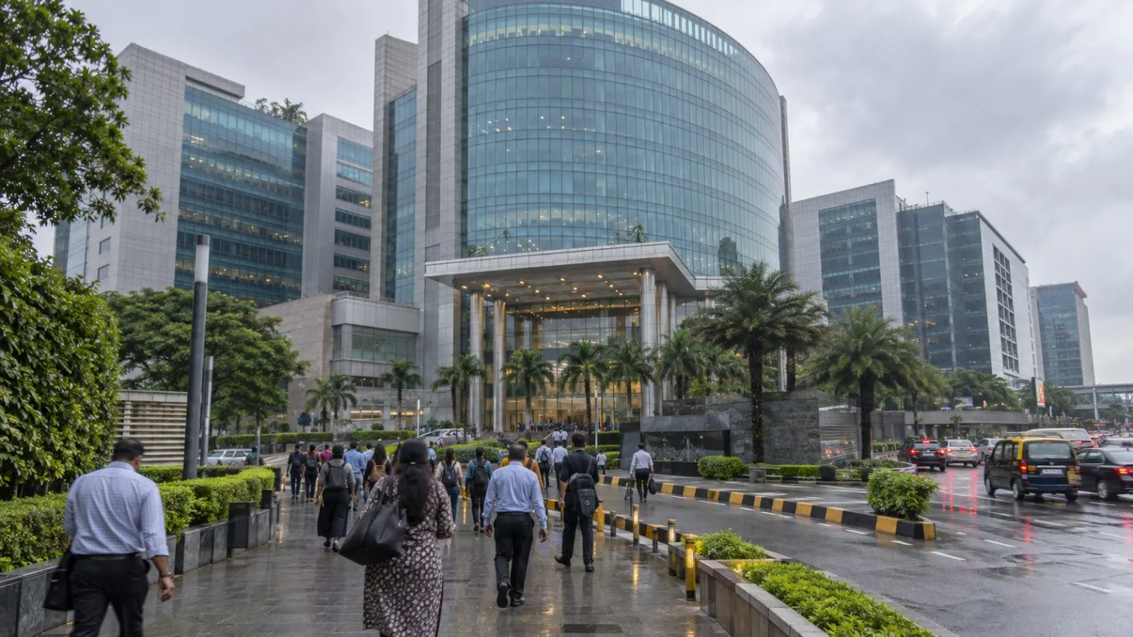 Commuters pass Exchange Plaza in Mumbai’s Bandra Kurla Complex beneath a cloudy morning sky. (AI-generated image / EconoTimes)