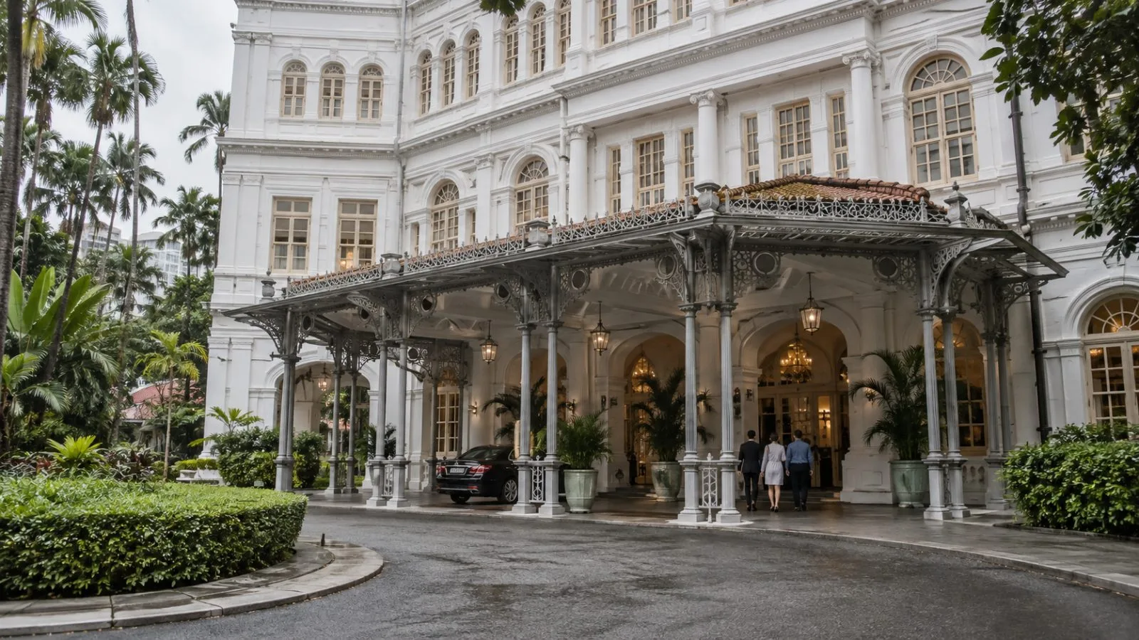 The entrance to Raffles Hotel stands under overcast skies in Singapore. (AI-generated image / EconoTimes)