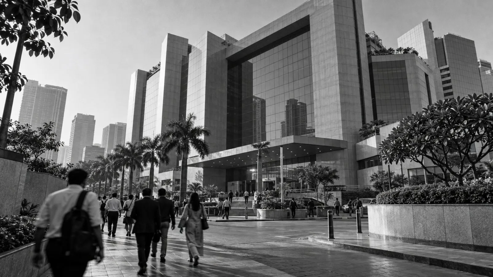 Pedestrians pass the National Stock Exchange headquarters in Mumbai on a clear morning. (AI-generated image / EconoTimes)