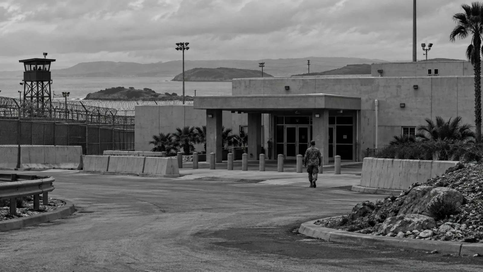 The military commissions courtroom building stands inside the U.S. naval base at Guantanamo Bay, Cuba. (AI-generated image / EconoTimes)