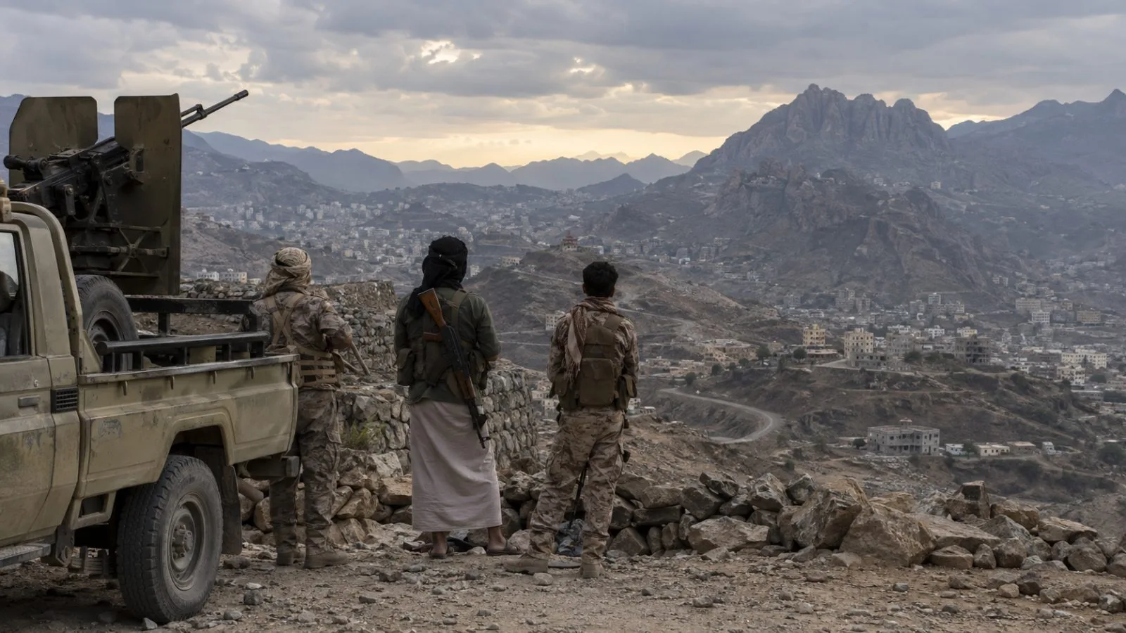 Yemeni soldiers stand beside a military vehicle at a position on the outskirts of Taiz. (AI-generated image / EconoTimes)