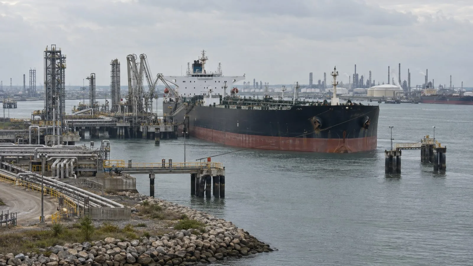 A crude carrier loads at a Port of Corpus Christi export dock in Texas. (AI-generated image / EconoTimes)