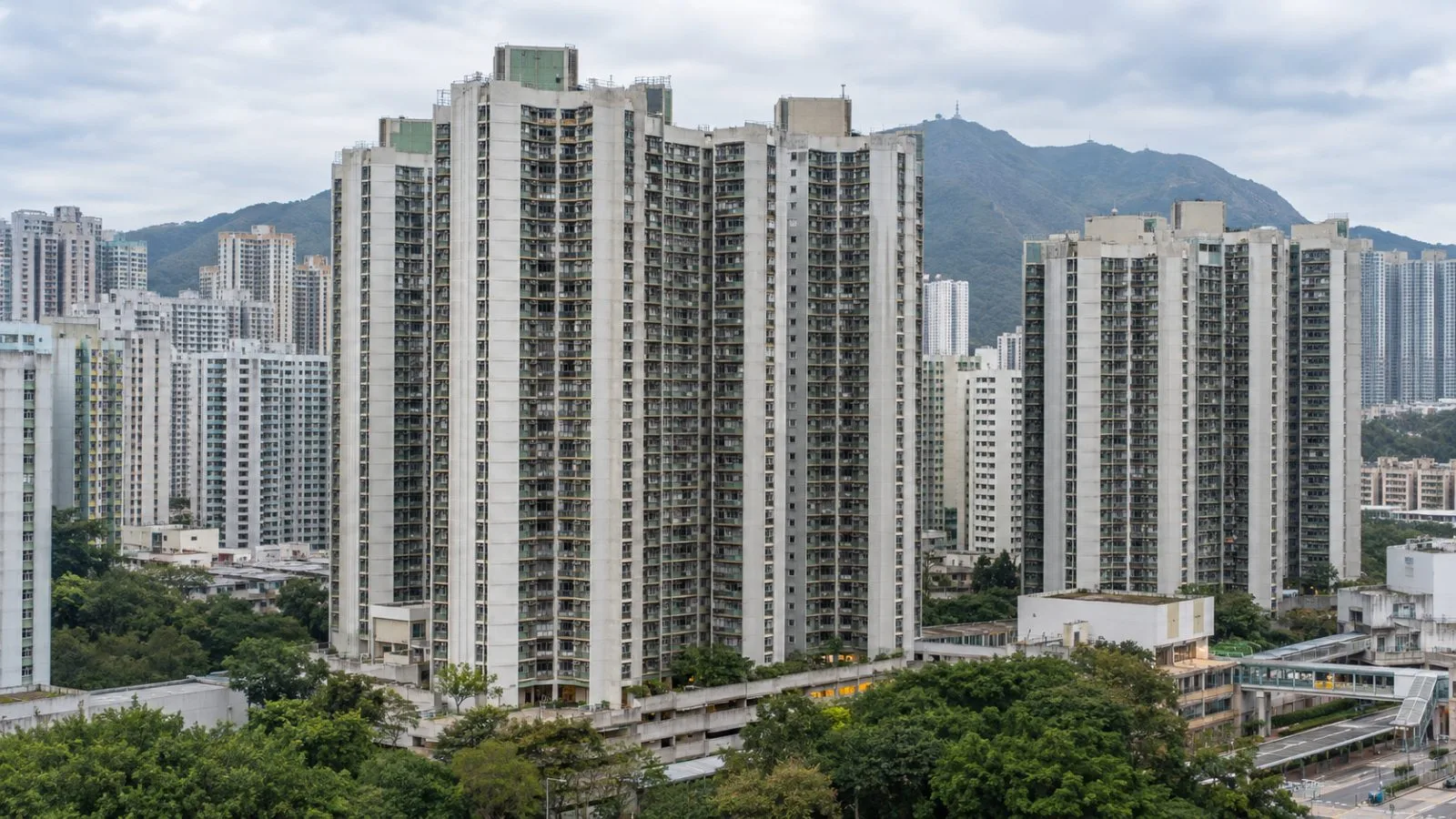 Residential towers stand at Wang Fuk Court in Tai Po, Hong Kong. (AI-generated image / EconoTimes)