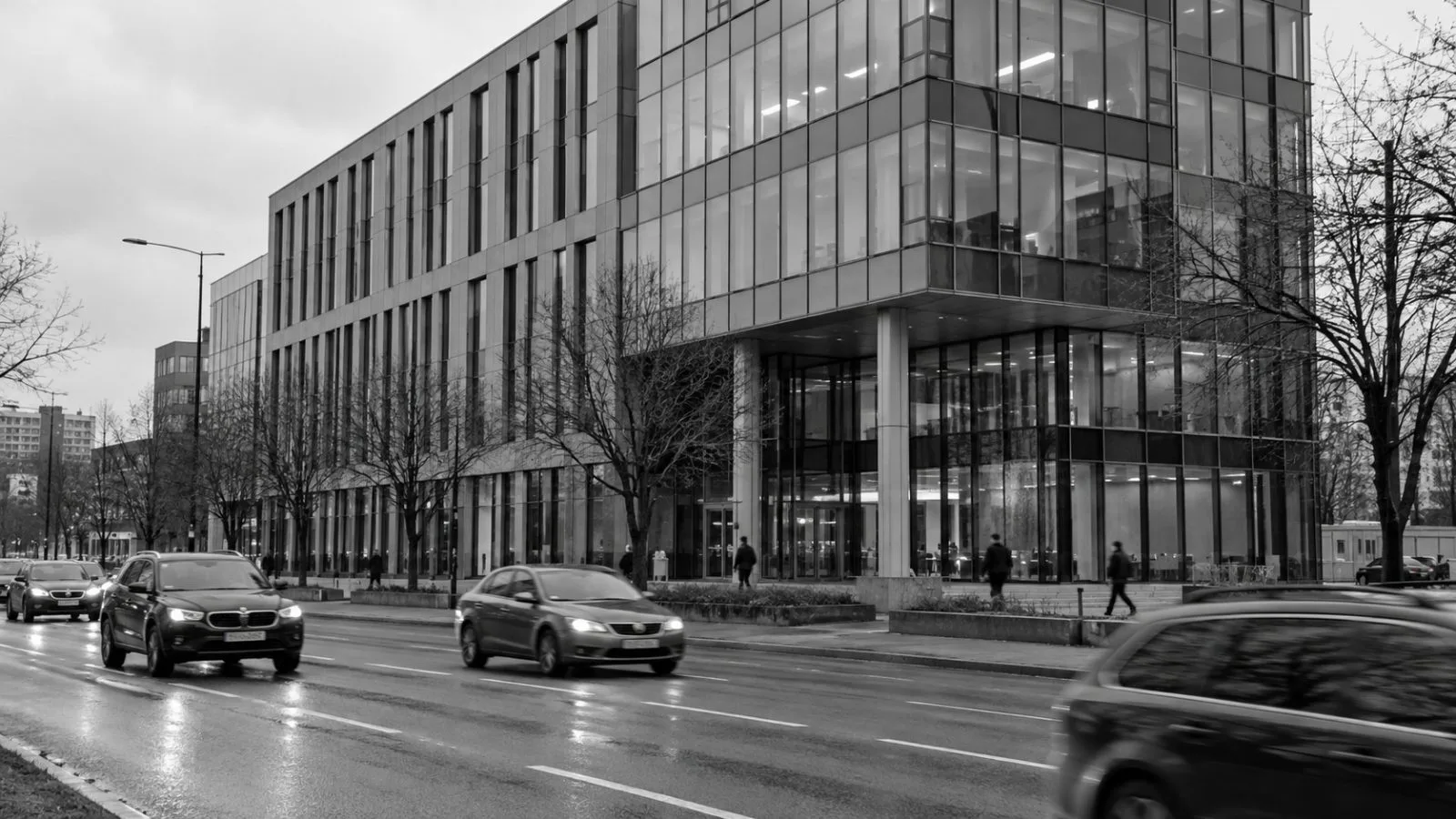 An office building fronts Savanorių Avenue in Vilnius, Lithuania, beneath an overcast sky. (AI-generated image / EconoTimes)