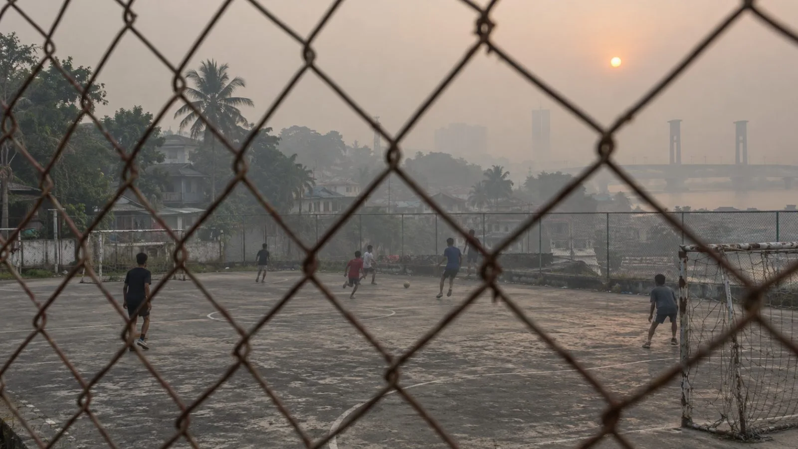 Teenagers play futsal through dense haze at an outdoor court in Palembang, Indonesia (AI-generated image / EconoTimes)